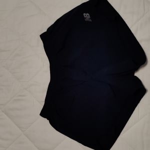 Women's New Balance Medium blue lined running shorts